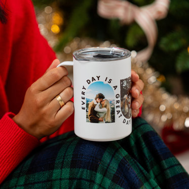 Hands holding a stainless steel photo travel mug featuring a couple kissing with the text 'Every day is a great day.'