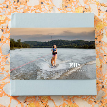 Hardcover Photo Book from Mpix with Beau Blue Linen Cover and Skinny Photo Dust Jacket featuring a senior photo.