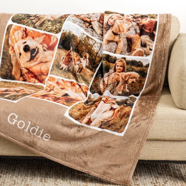 A personalized blanket from Mpix draped over a couch.