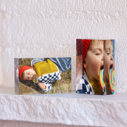 Two 2x3" mini acrylic blocks. One displayed horizontally and the other vertically. Both blocks feature photos of a toddler boy licking a giant colorful lollipop.