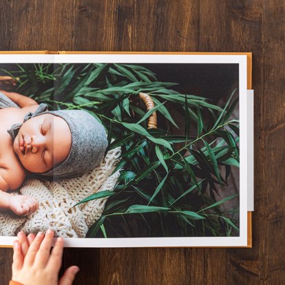 A premium photo book spread on a table showing off the seamless spreads.