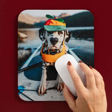 A customized mouse pad from Mpix with a photo of a dog printed on the smooth polyester surface of the product.