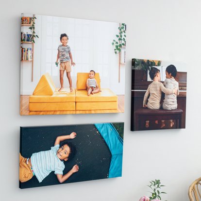 a collection of different large canvas gallery wraps hung in a gallery wall