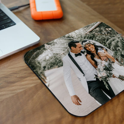 Personalized mouse pad with wedding photos.