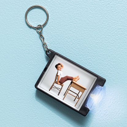 Personalized photo flashlight keychain with a family portrait photo. 