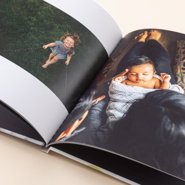 An open spread of a classic photo book showing off the custom designed layouts.