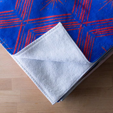 A close of image of the corner of a personalized towel from Mpix showing the soft microfiber material.