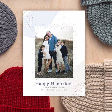 A hanukkah card from Mpix featuring a large personalized photo and happy hanukkah message on a geometric patterned background. 