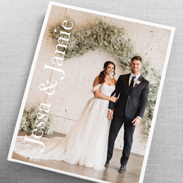 A custom cover photo book from Mpix with a wedding photo of the bride and groom and the text "Jessa & Jamie"