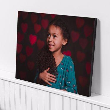 Standout Photo Print from Mpix with a black base and photo of a young girl on a background of hearts for Valentines Day