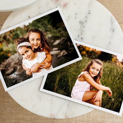A collection of family pictures printed on archival quality papers with white borders.