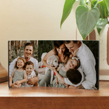 A Tabletop Hinged Print from Mpix featuring a photo of a father and his children on one side next to a family photo on the other side.