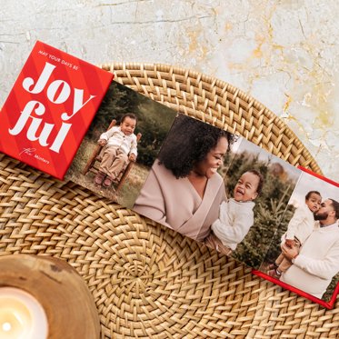 Holiday themed accordion mini brag book with 'joyful' on the front cover.