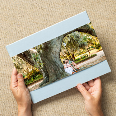 A photo book from Mpix with a tan linen cover and skinny photo dust jacket.