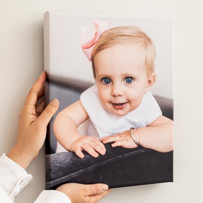 a premium canvas print of a child with striking blue eyes