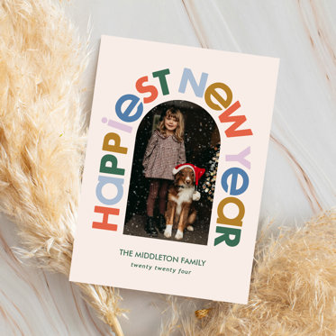 A Happy New Years Card with the headline "Happiest New Year" as an arched border around a photo and personalized text at the bottom of the card.