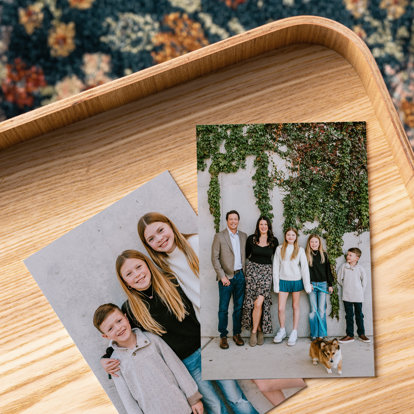 Two Photo Prints from Mpix featuring images of a family and laying in a wooden tray.