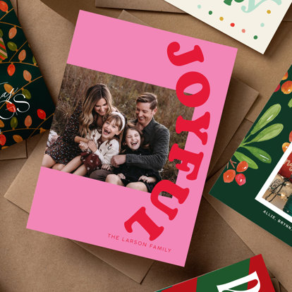 A collection of colorful christmas and holiday cards personalized with family photos and holiday greetings.