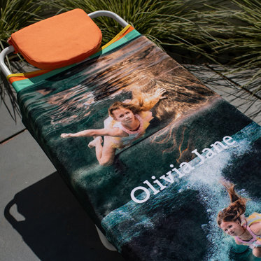 A personalized photo towel from Mpix featuring a collage design of photos and custom text.