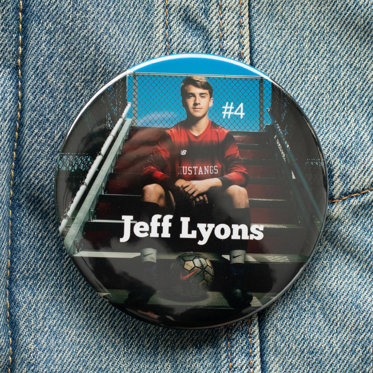 A photo button from Mpix featuring a sports photo of a high school athlete with their name written in white text to showcase the custom text feature. 