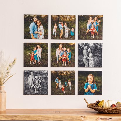 A photo grid of nine premium photo tiles evenly spaced on the wall featuring a family portrait session