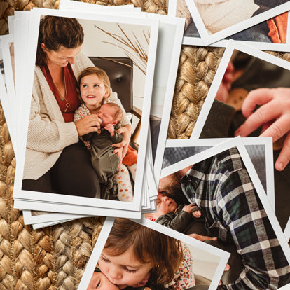 Prints from a Signature Print Set spread out to show various images of a family.