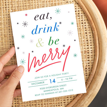 A Holiday Party Invitation from Mpix with an invite to eat drink and be merry for christmas written in rainbow lettering on a white background decorated with colorful falling snowflakes. 