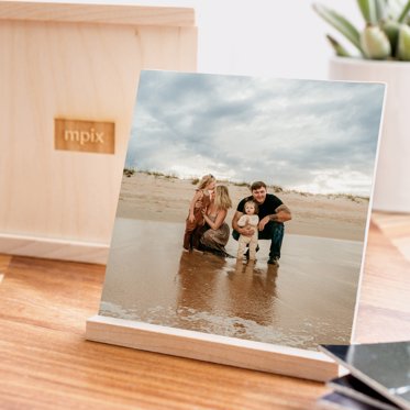 A print from a thumbrint wood photo box from Mpix standing in the wooden display piece.