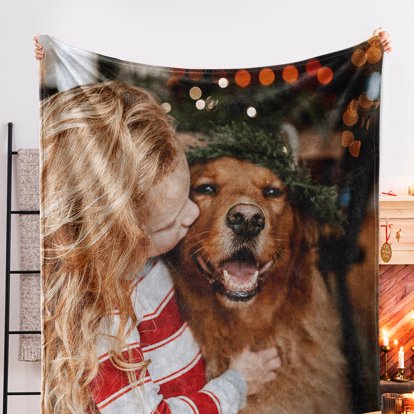 a giant personalized blankets featuring a young girl and her dog embracing under the christmas tree