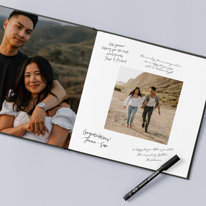 An open premium guest book featuring engagement photos and handwritten notes.