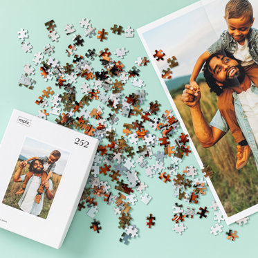 An image showing what is included when a customer orders a puzzle from Mpix - puzzle box, puzzle pieces, and 12x18 Poster Print for reference.