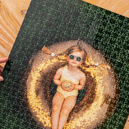 A close-up of an assembled photo puzzle from Mpix featuring a summery image of a young girl.