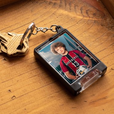 Flashlight keychain from Mpix with a personalized photo behind acrylic protector and an LED flashlight. 