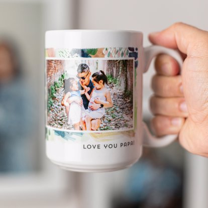 A personalized photo mug with a colorful pattern and large photo.