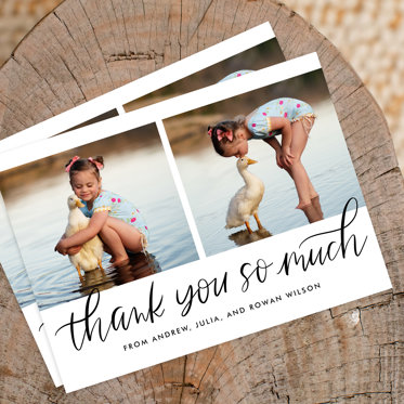 A baby shower thank you card featuring a photo of a toddler girl standing in shallow water kissing the top of a duck's head..