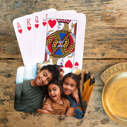 personalized playing cards laid out on a table showing off your photo on the back