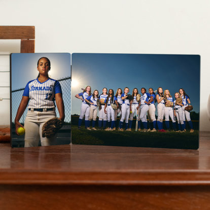 A tabletop hinged print from Mpix with a vertical photo of a softball player and a horizontal photo of the full softball team.