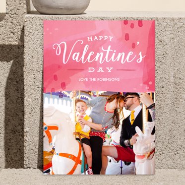 Valentine's Day Card from Mpix with Happy Valentine's Day written in white script on a mixed pink background decorated with hearts and room for a personalized photo.