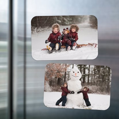 two winter photos printed on magnets and on display on the fridge