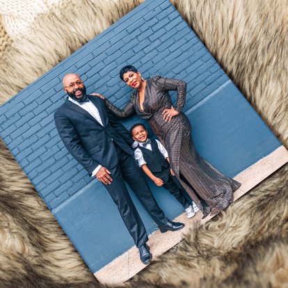 A custom image hardcover book with a matte finish cover featuring a family portrait. 