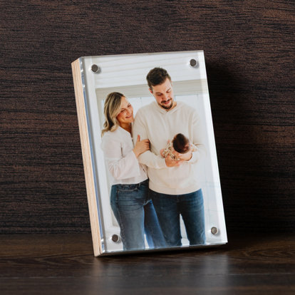 A birch photo block featuring a print of a parents holding their newborn baby.