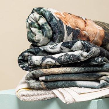 A stack of photo blankets from Mpix.