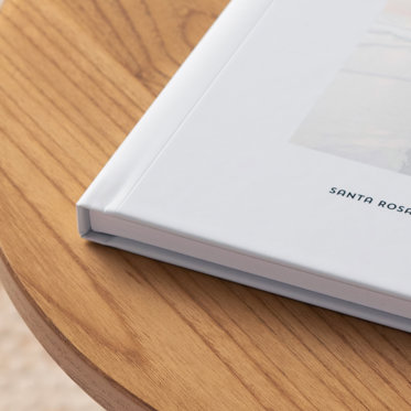 A close up image showing the corner of a custom cover photo book and how the cover wraps around the spine.