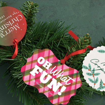 Personalized Christmas ornaments from Mpix in different shapes with red ribbons and a message of holiday wishes. 