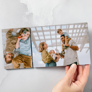 A tabletop hinged print from Mpix featuring family photos.