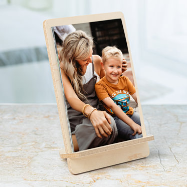 A Signature Press Print Set of family photos displayed on a maple veneer MDF stand.