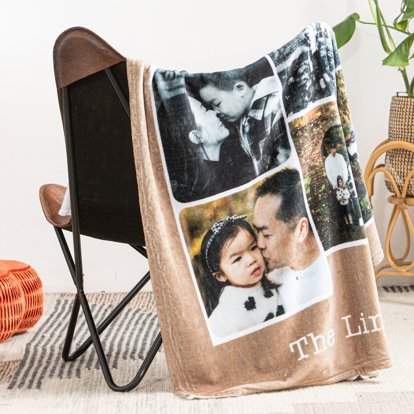 A personalized blanket featuring a collage design of family images and personalized text that is draped over the back of a chair.