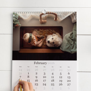 someone marking down a special occasion on their calendar using our signature paper, the most popular option