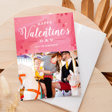 A happy valentines day card from Mpix with a family photo of a couple holding their newborn. 