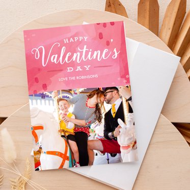 A happy valentines day card from Mpix with a family photo of a couple holding their newborn. 